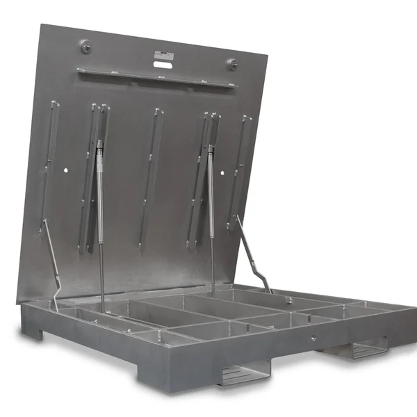 The image shows a large metal platform with hydraulic mechanisms and separate compartments, likely used for industrial purposes or storage. Incorporating industrial scales, the platform is slightly inclined with support rods and appears robust and functional.