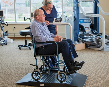 wheelchair scale for use in healthcare shown in a physical therapy setting